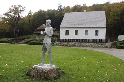 Statue of Nikola Tesla in front of his birth house